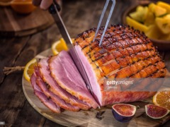 Carving Delicous Glazed Holiday Ham with Cloves