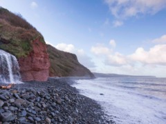 waterfall-over-red-cliffs-peppercombe-beach-devon-1197586